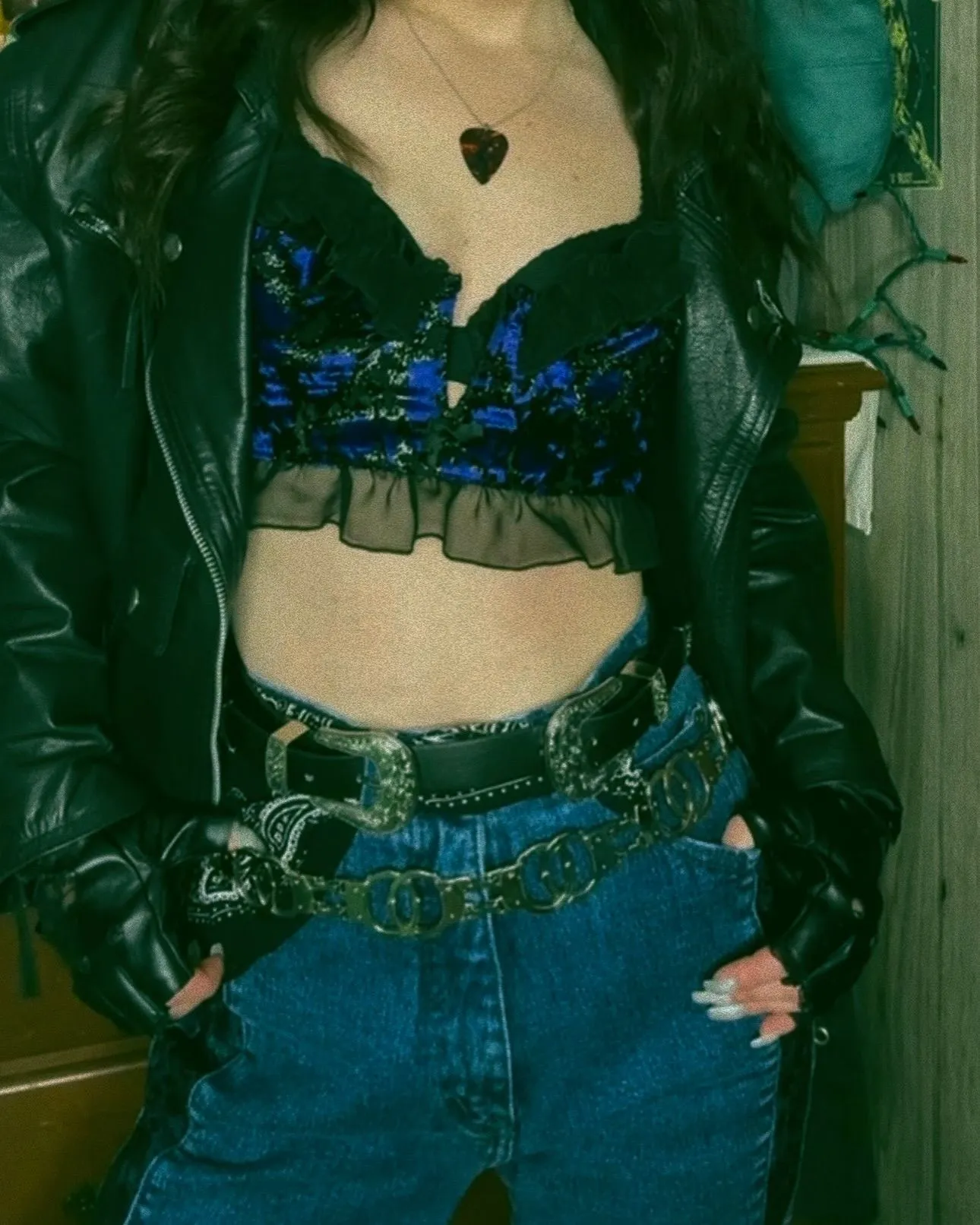 Detail shot of lace gloves and studded jewelry for 80s outfit