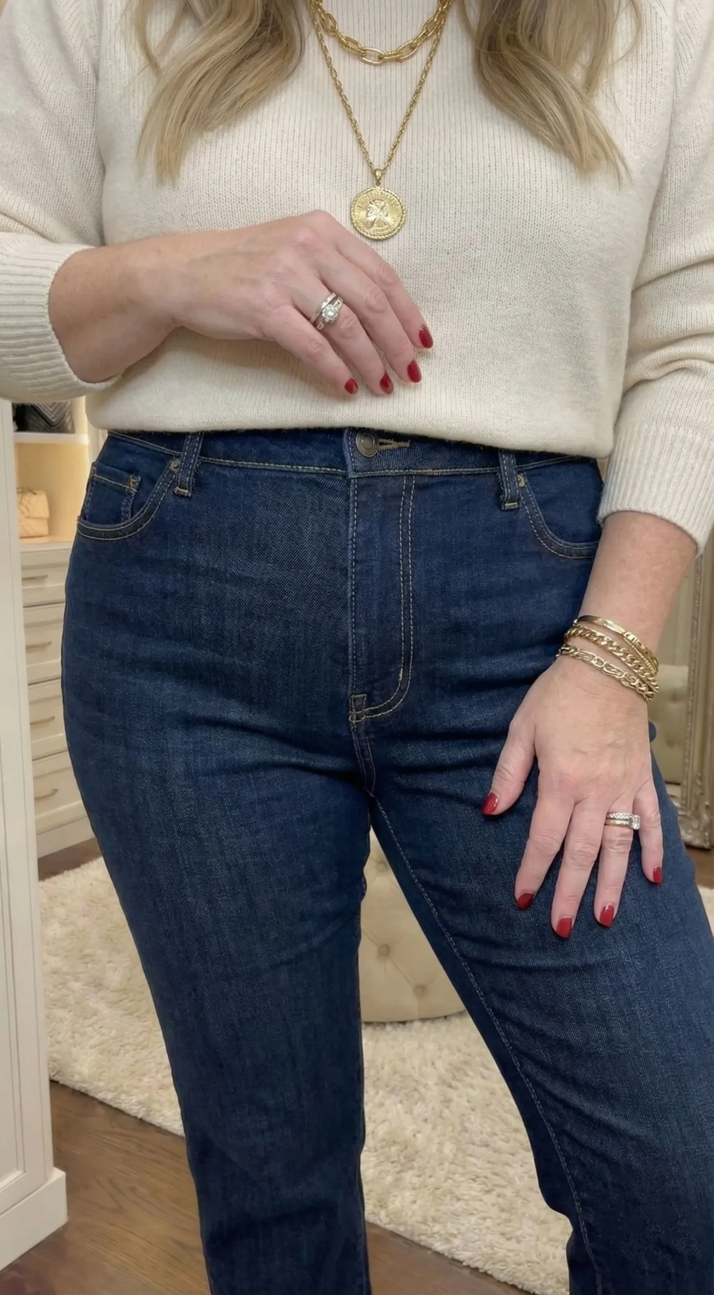 Close up detail of dark indigo straight leg denim fabric and stitching