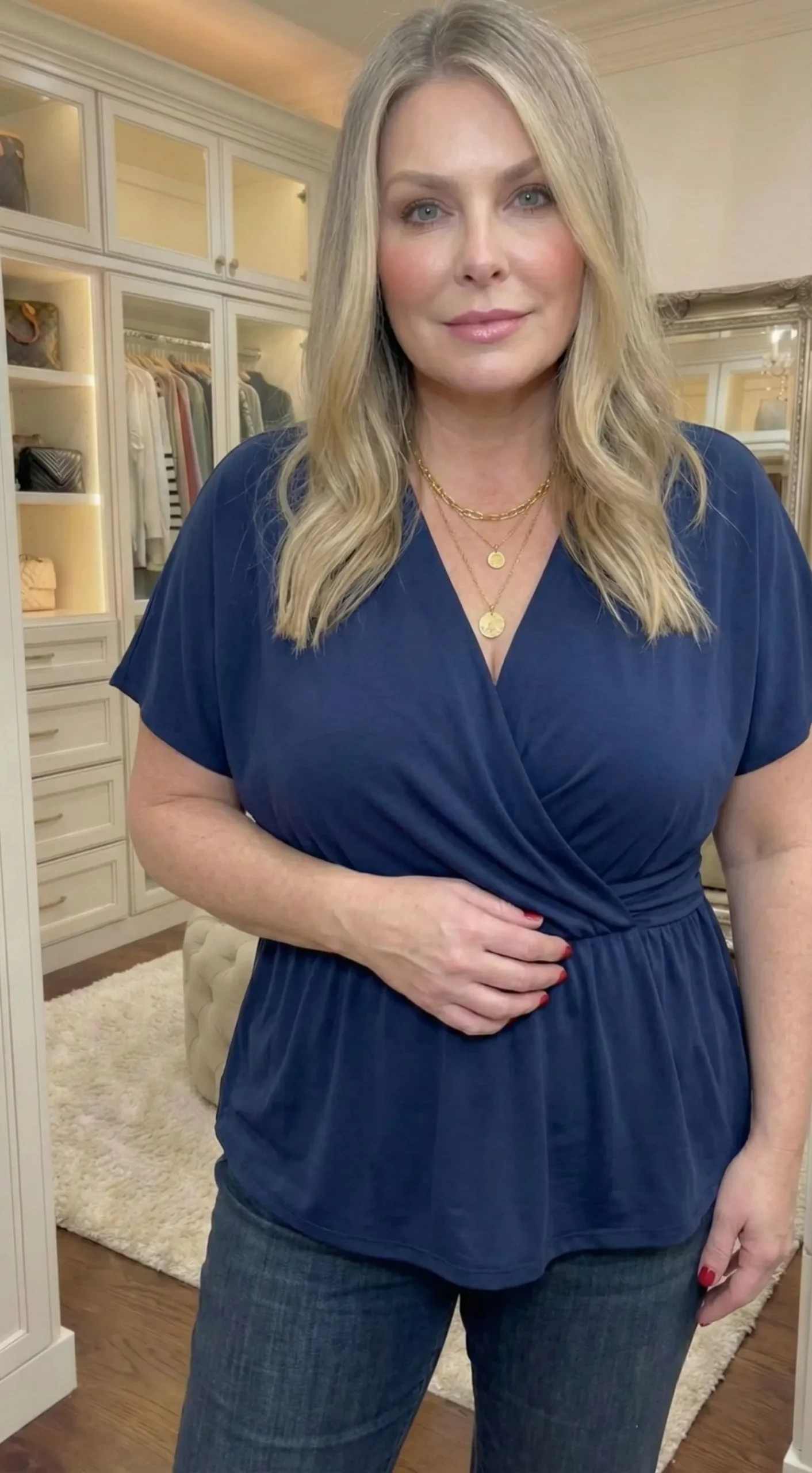 Close up of a deep v-neck navy blue blouse suitable for apple body shapes