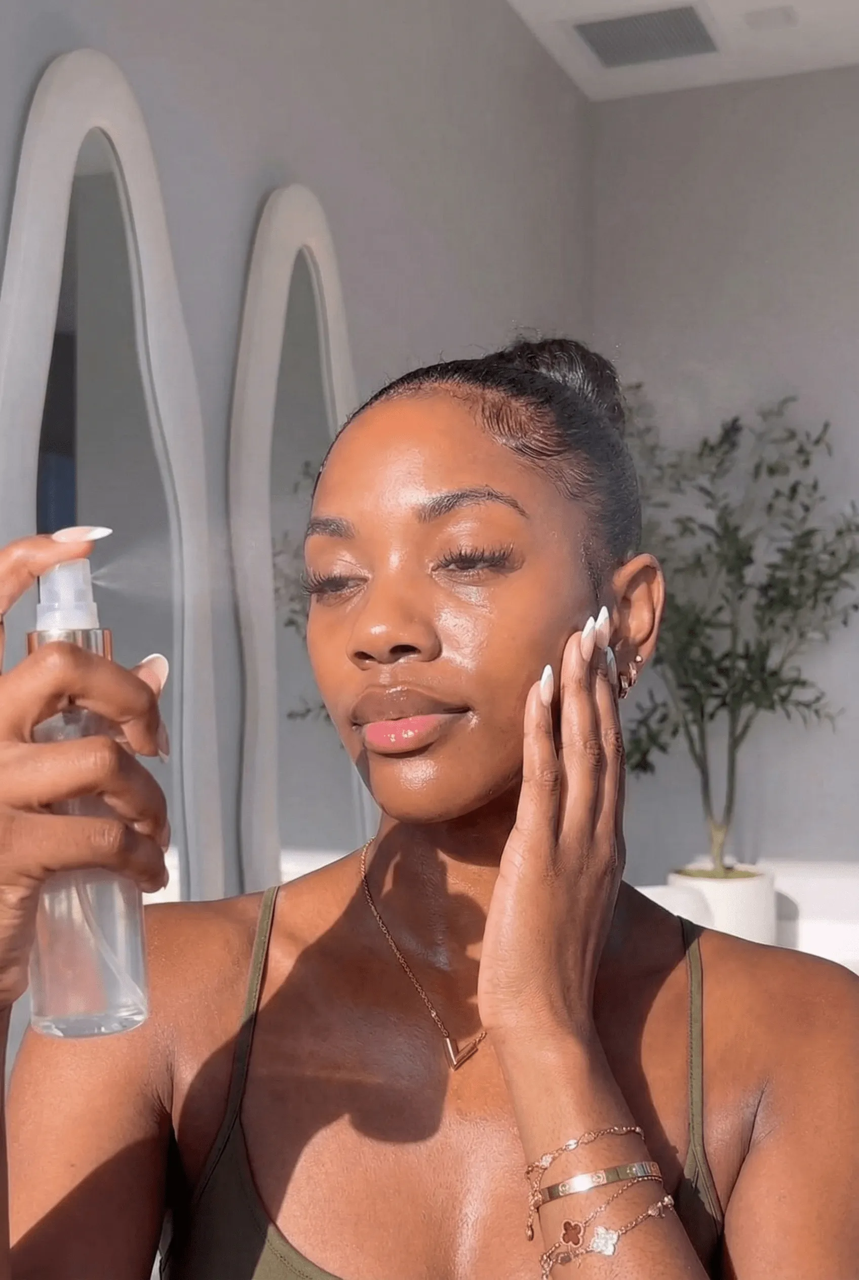 Close up of black model with glowing hydrated skin for strawberry girl makeup base