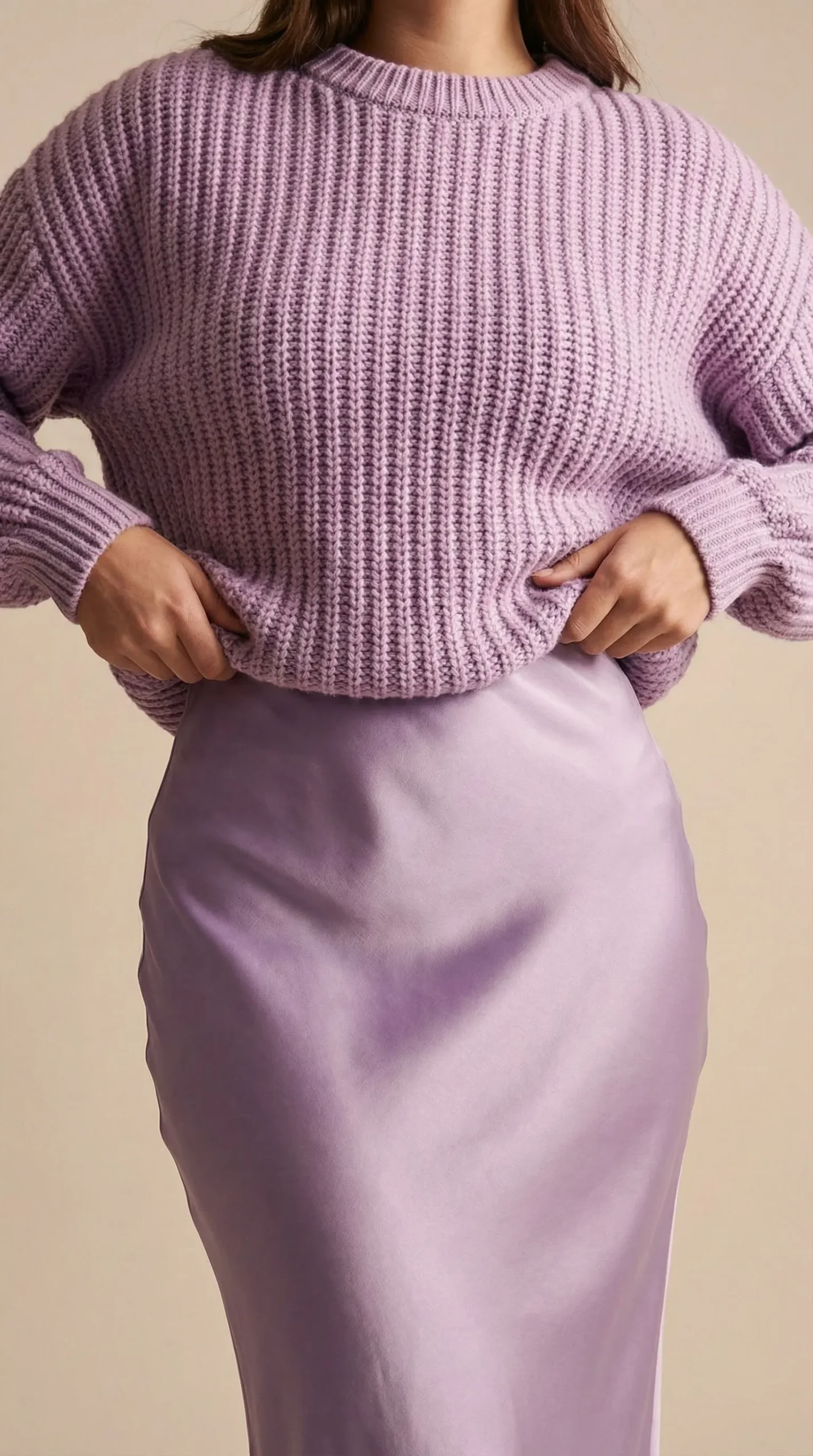 Model demonstrating the French tuck with a sweater and skirt