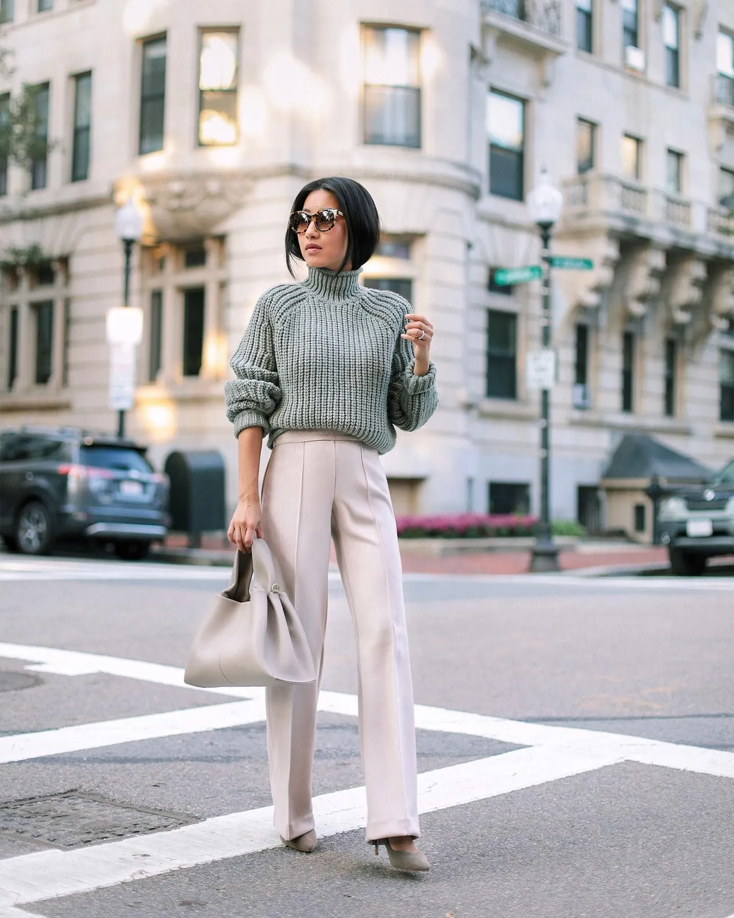 Woman wearing mint green slacks and a vintage polo for a Japanese City Pop look