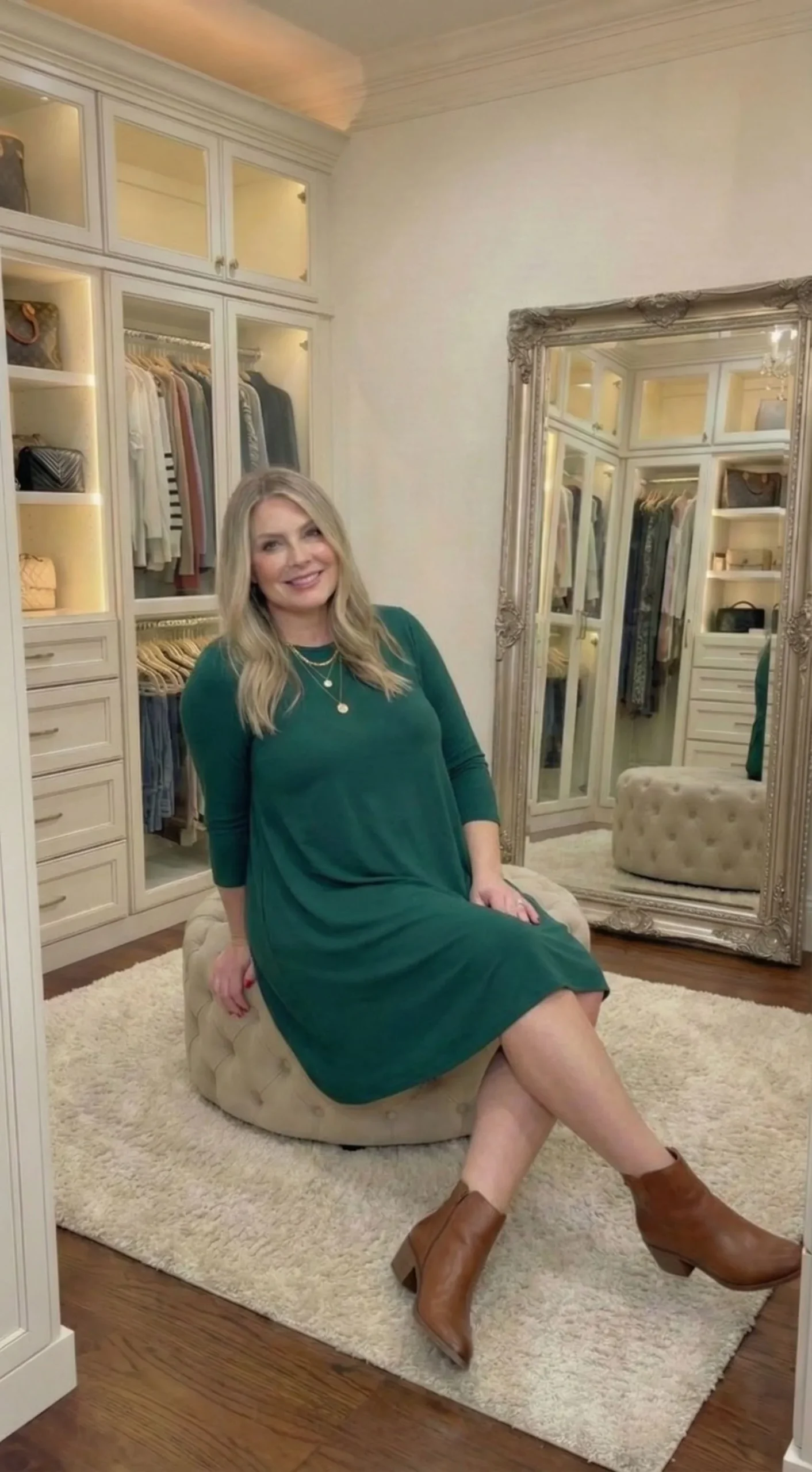 Plus size woman wearing emerald green swing dress and ankle boots