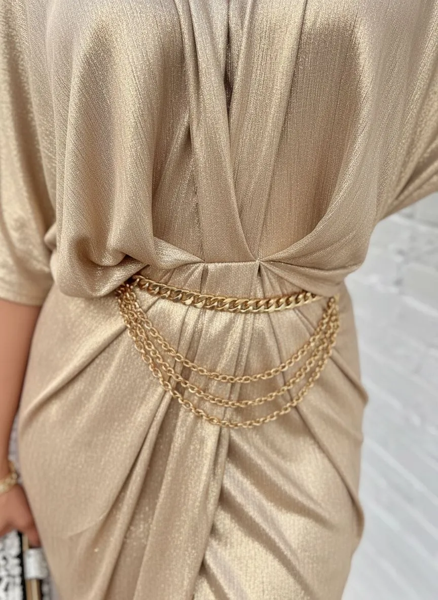 Close up of silver and gold metallic dress fabrics