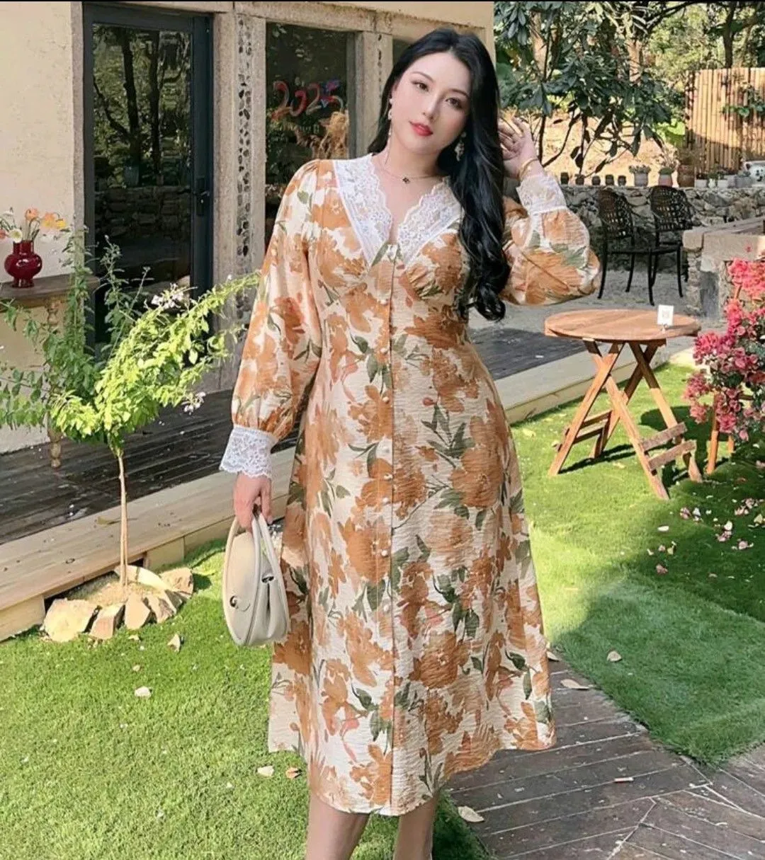 Petite curvy woman wearing a floral wrap dress and nude wedges for spring style