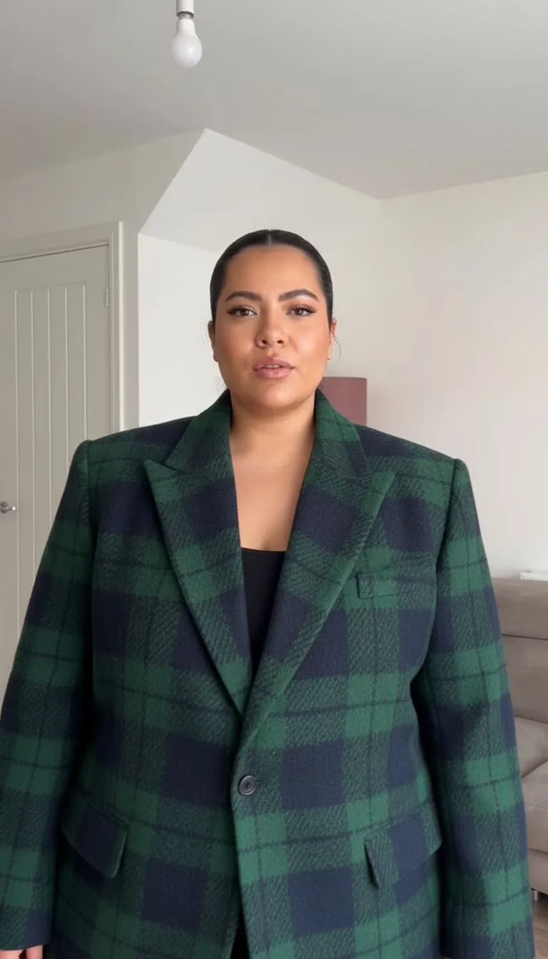 Close up of a green and navy plaid wool blazer for plus size dark academia style