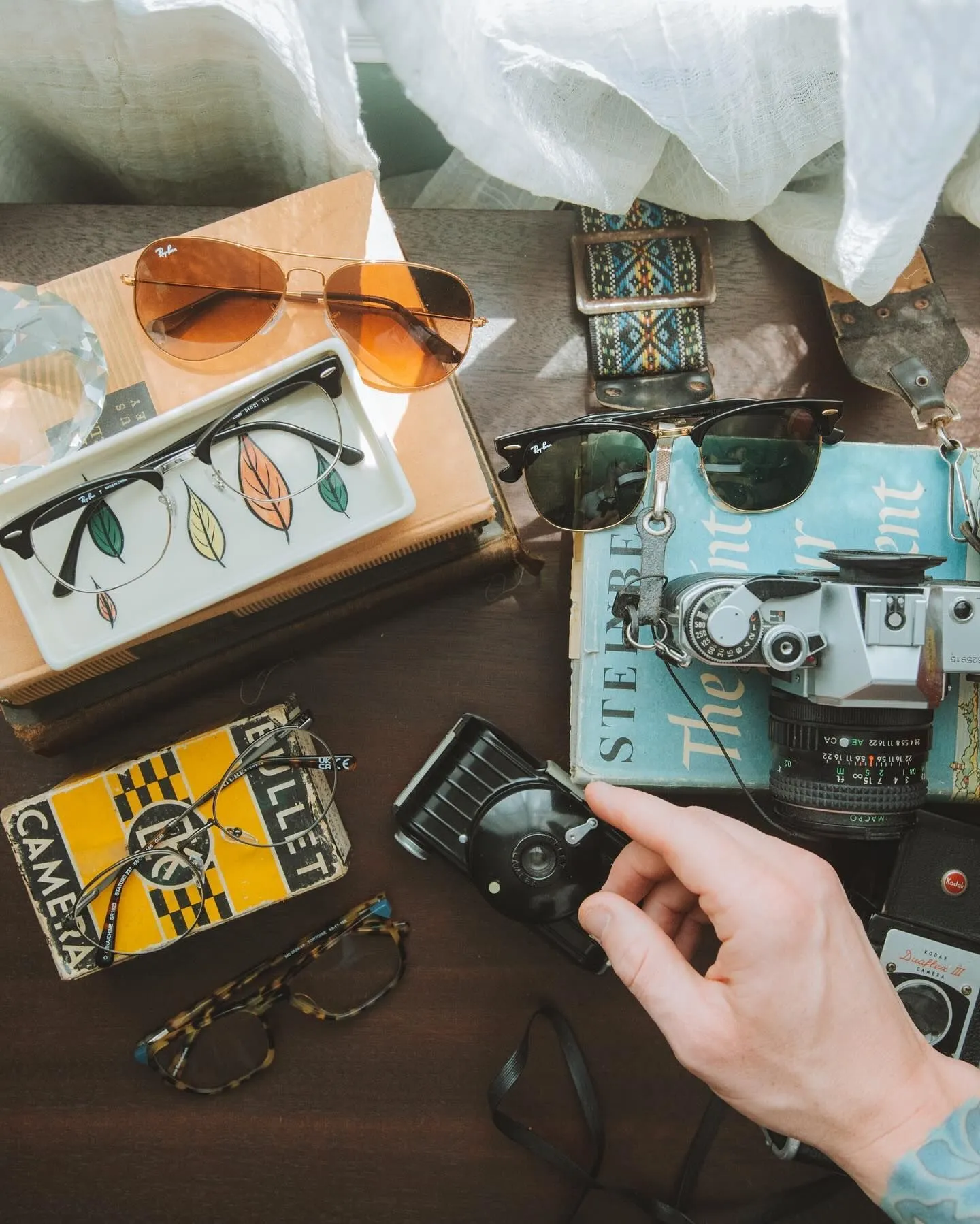 Vintage sunglasses and camera for travel aesthetic --no text, no words, no letters, no signboards, no logos