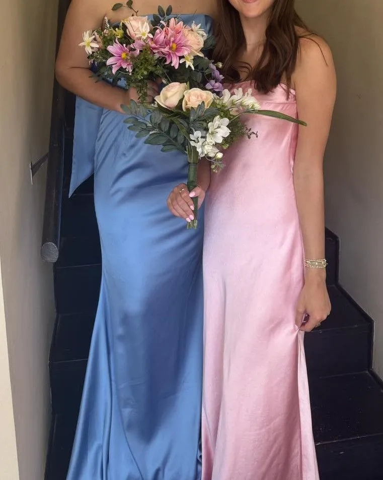 Ruby red champagne and navy blue satin fabric textures close up