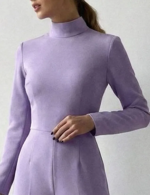 Close up of blush pink linen fabric texture on a high neck jumpsuit