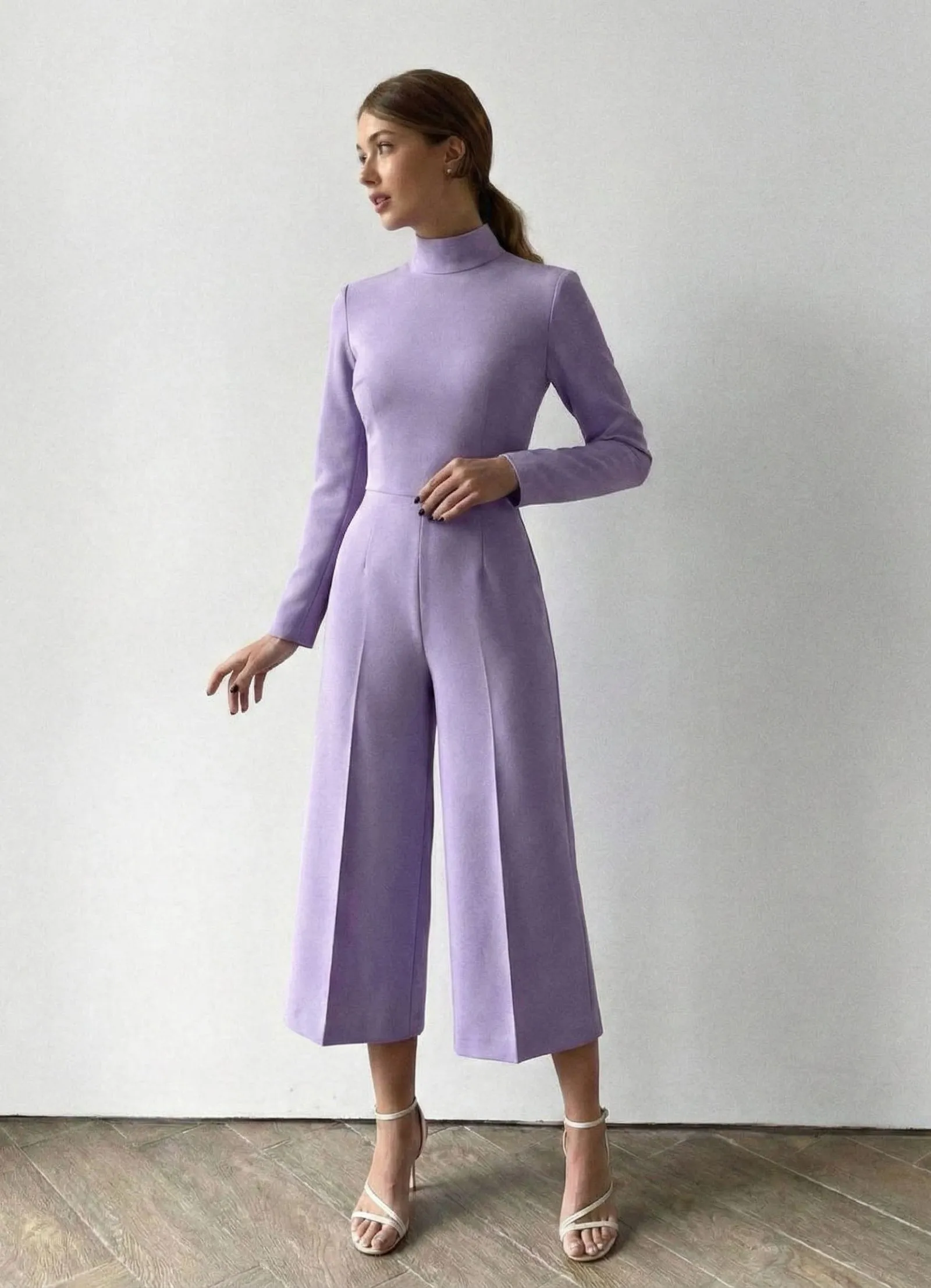 Woman wearing a lavender high-neck culotte jumpsuit for Easter church service