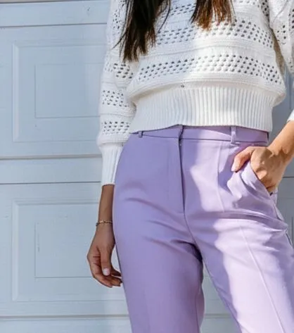 Close up of lavender trousers paired with oatmeal knit fabric