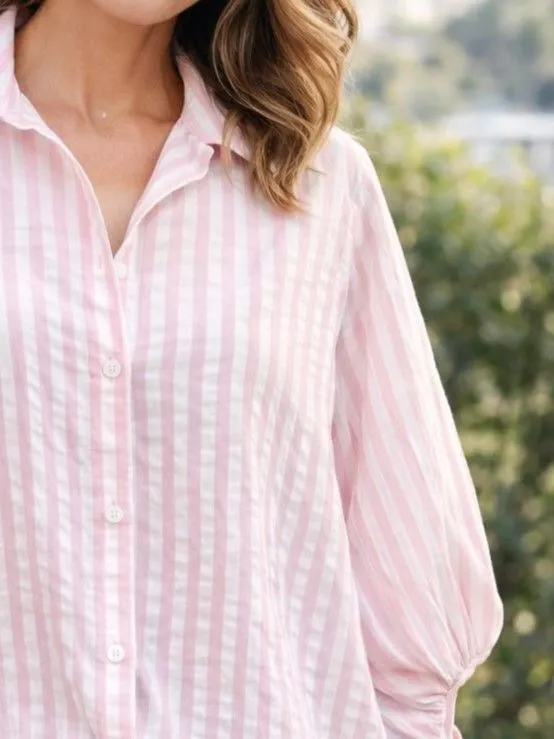 Close up of pink and white seersucker fabric texture