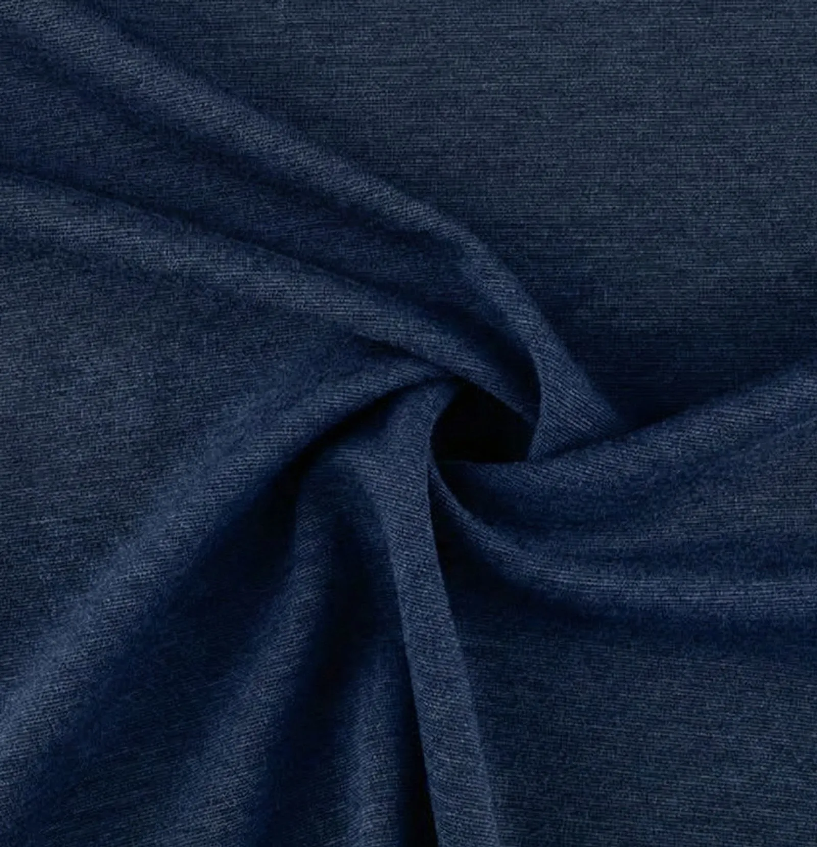 Close up of navy blue ponte knit fabric texture styled with a pearl brooch