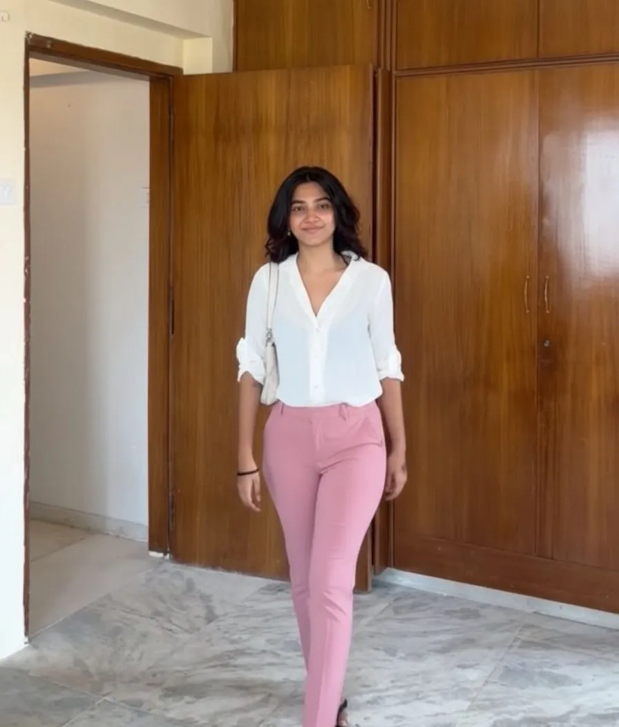 Curvy woman wearing tailored pink cigarette pants
