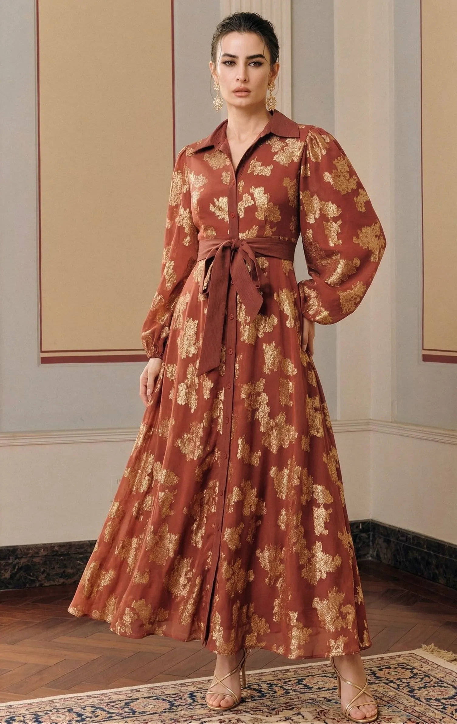 Curvy woman wearing a belted terracotta button-down maxi dress with Southwestern prints