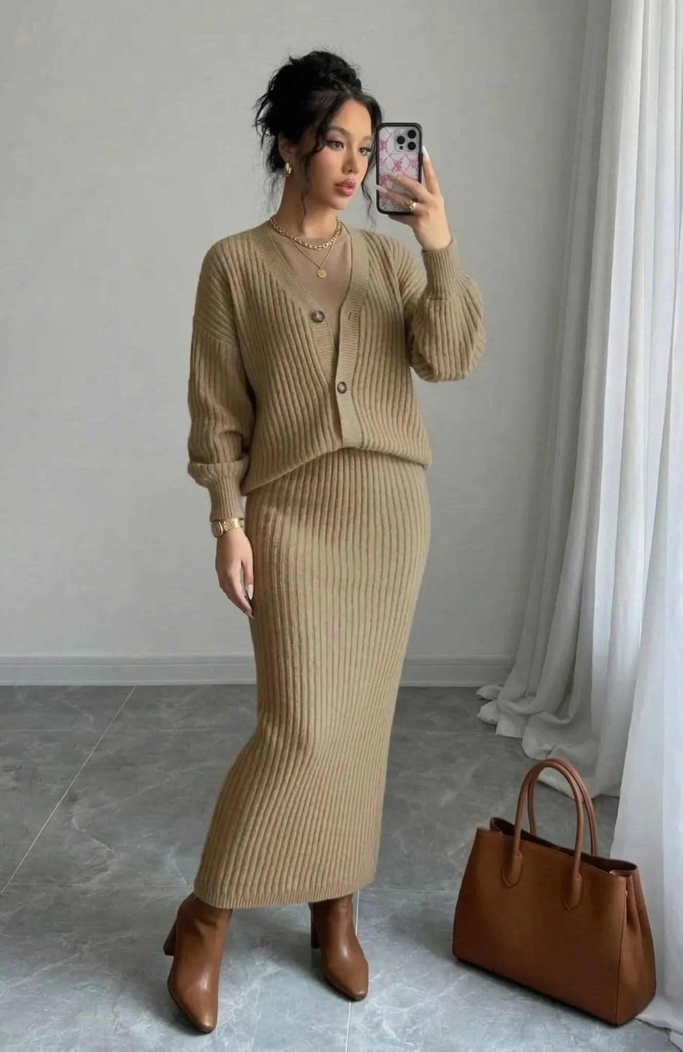 Woman in camel knit skirt and cardigan for business casual