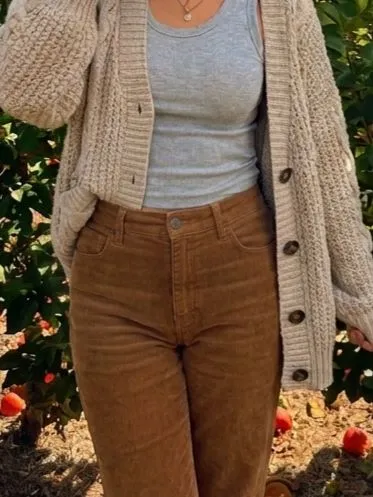 Close up showing chunky cream knitwear next to vintage wash mocha corduroy