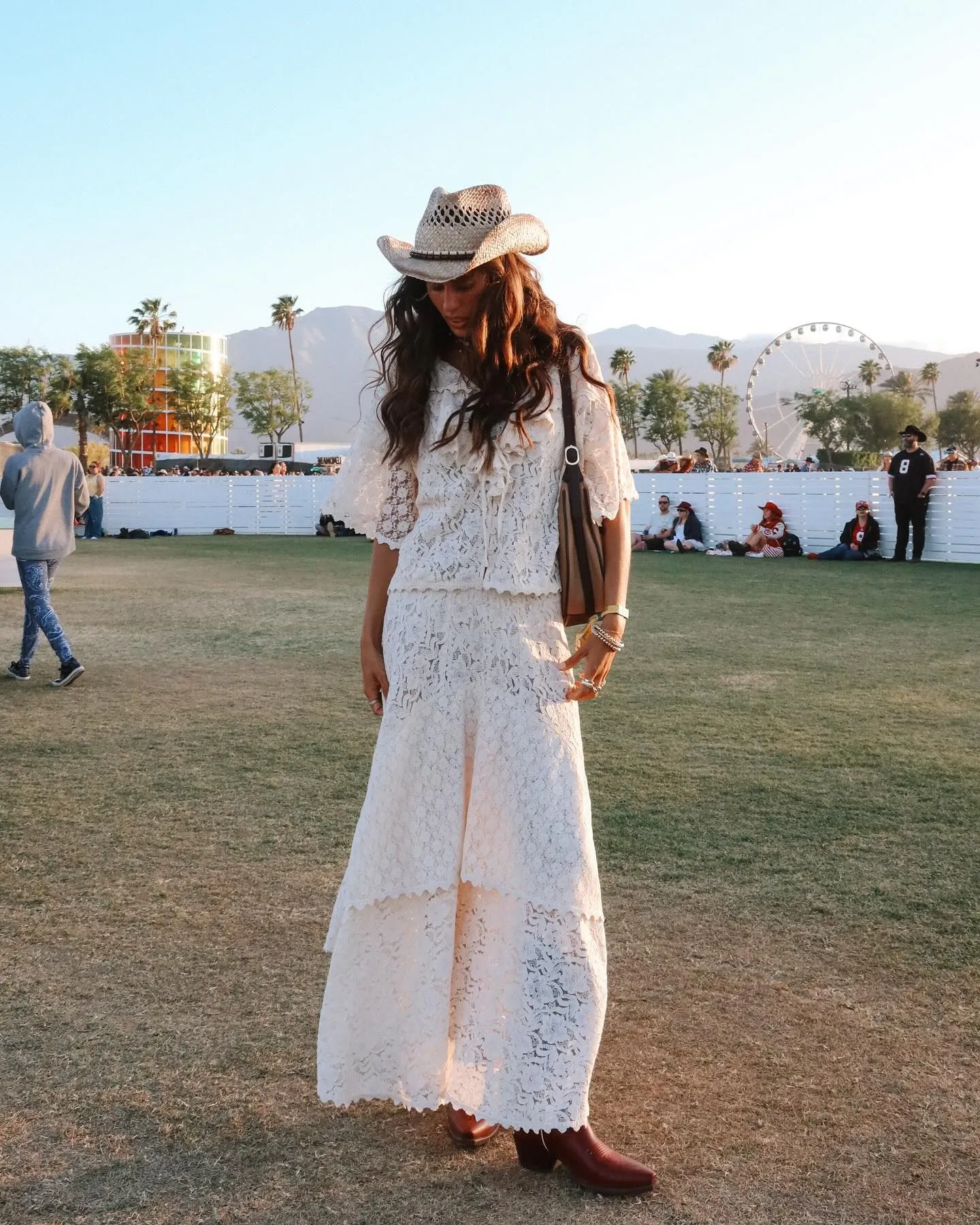 Petite woman wearing a cream crochet mini tunic with boy shorts for a comfortable festival look