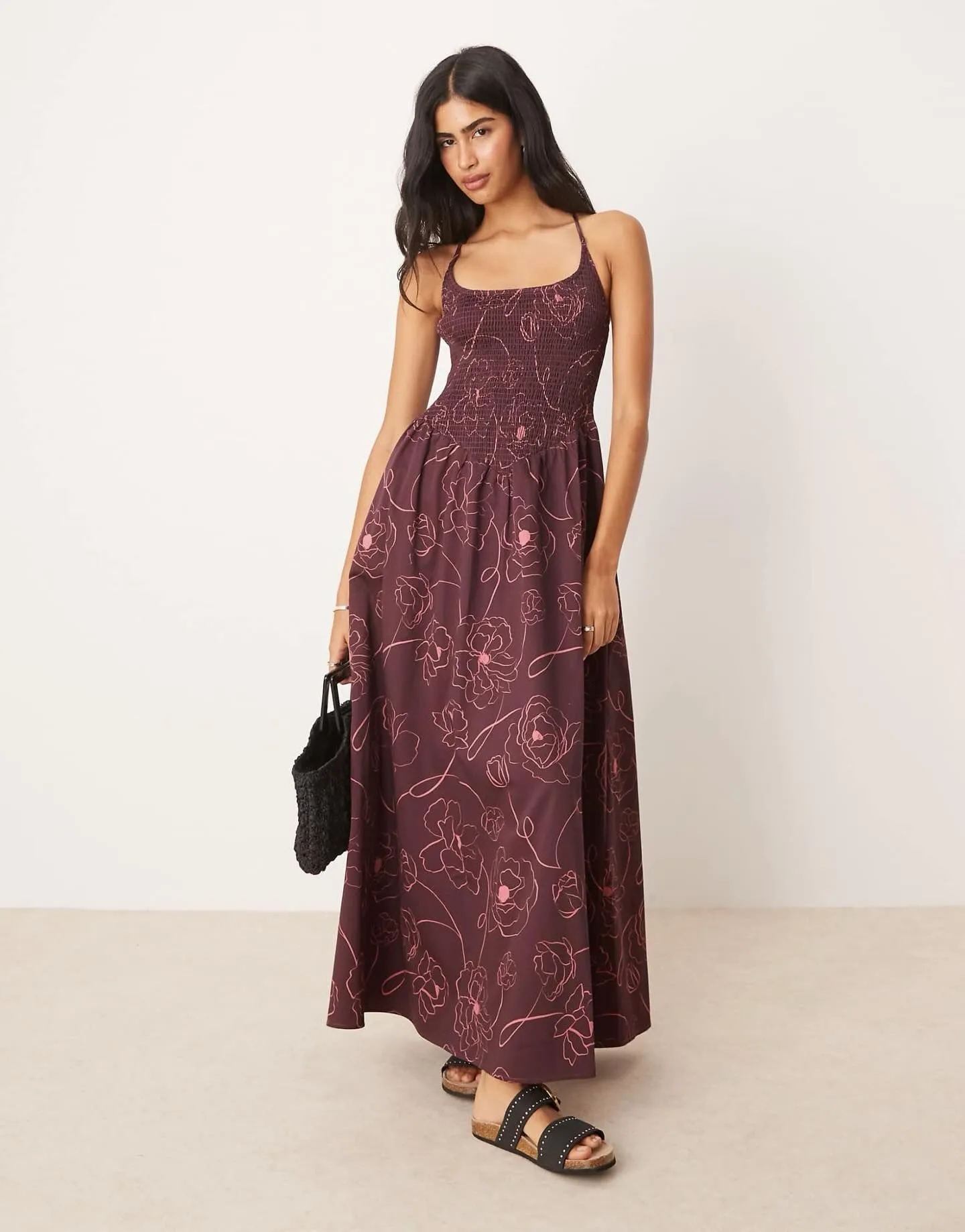 Model wearing a floral corset-style Western maxi dress flattering an hourglass figure