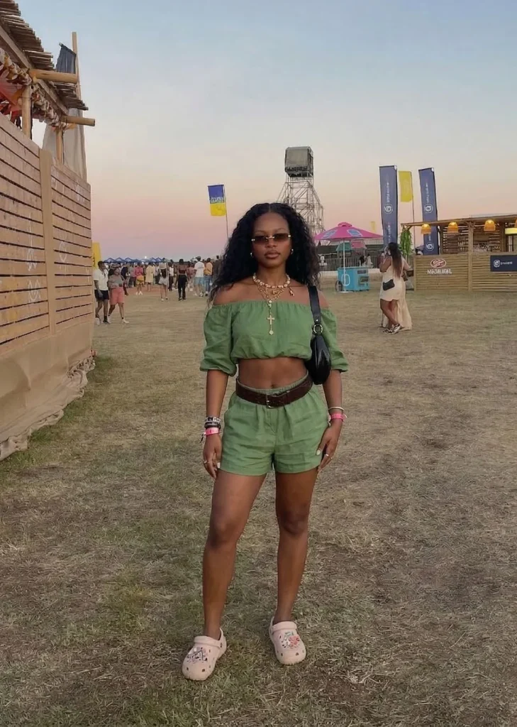 Petite model wearing a comfortable green linen skort set to a summer music festival
