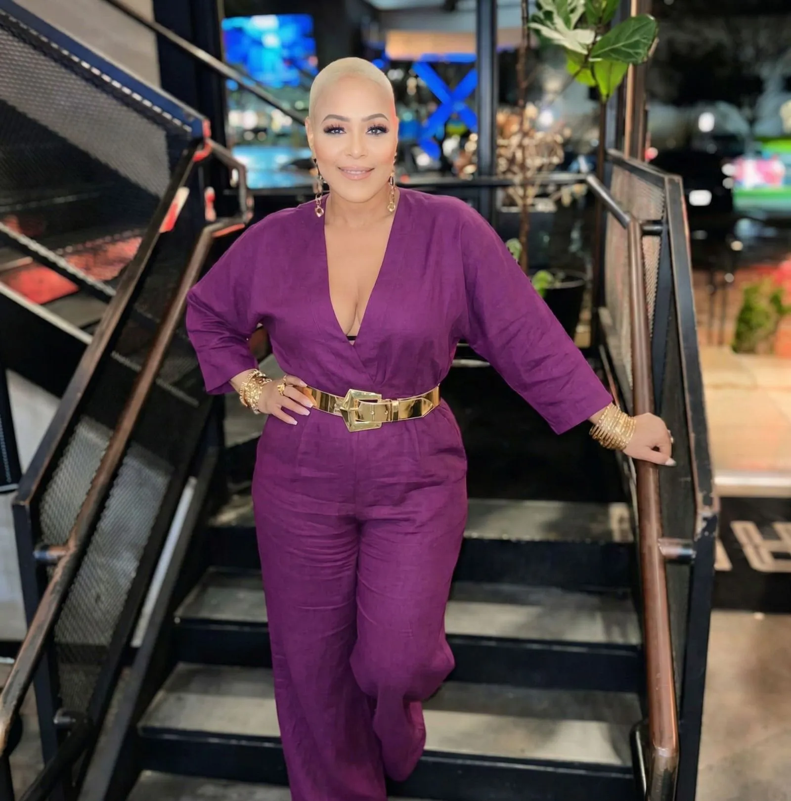 Deep purple linen outfit with gold accessories for LSU football fashion