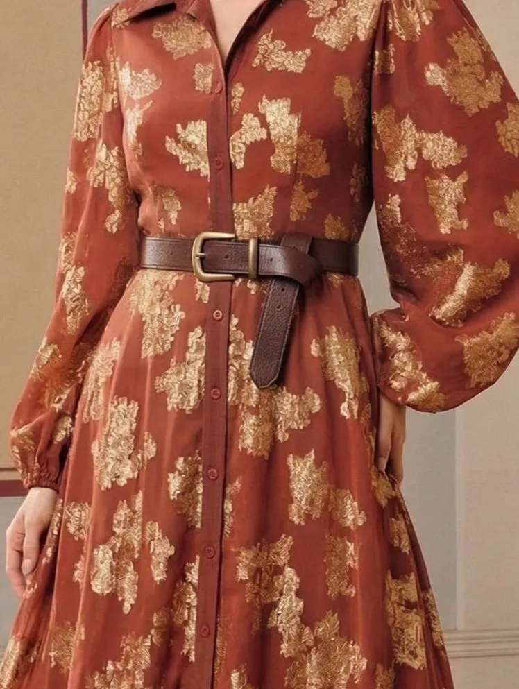 Woven leather belt cinching the waist of a Southwestern print dress