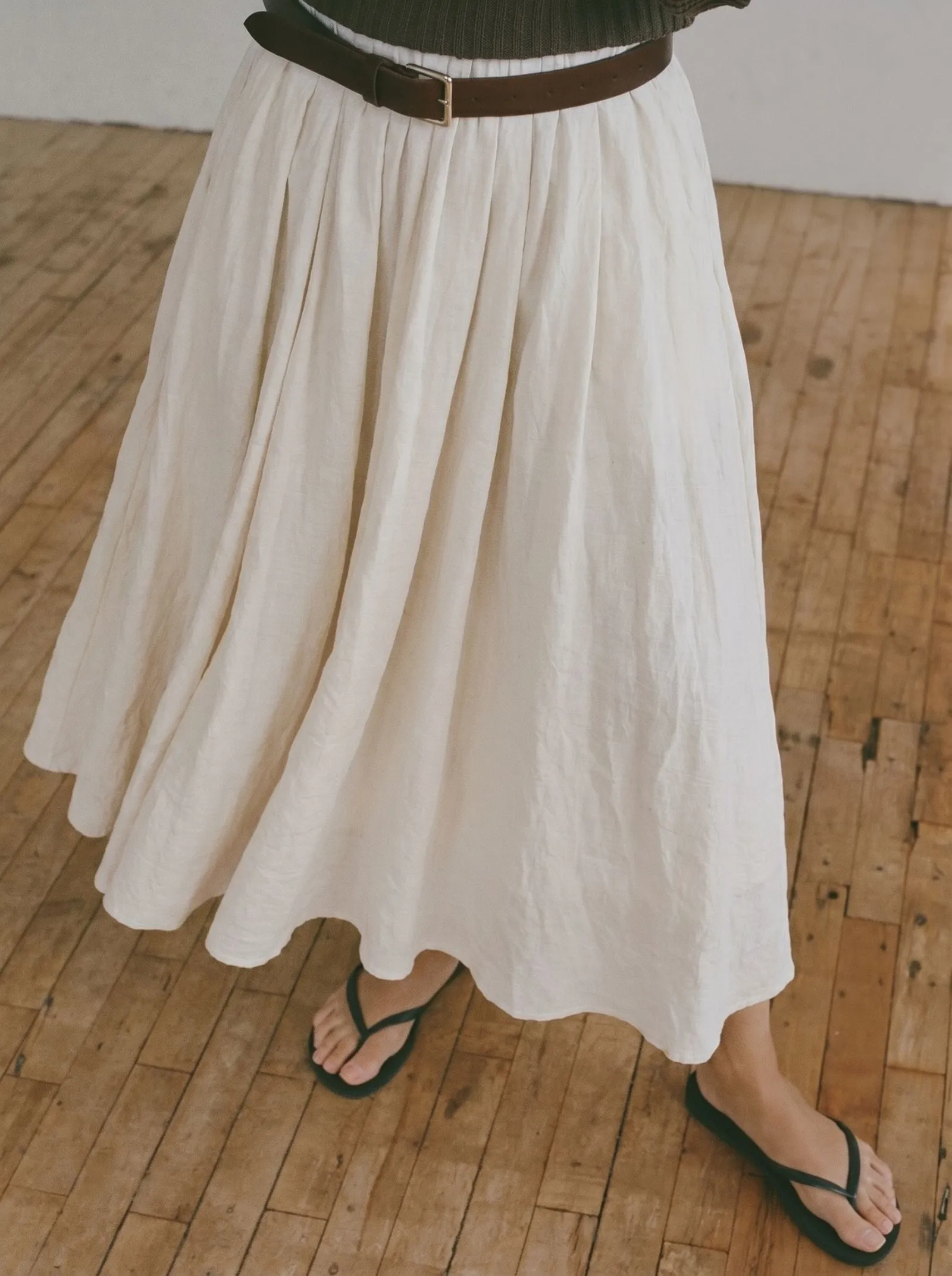 Close up detail of a flowy textured cotton midi skirt for summer heat