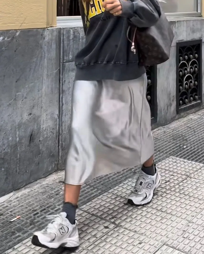 Clean white leather sneakers paired with a summer romper