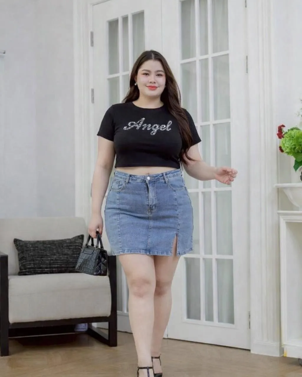 Close up of raw hem denim skirt and soft cotton t-shirt