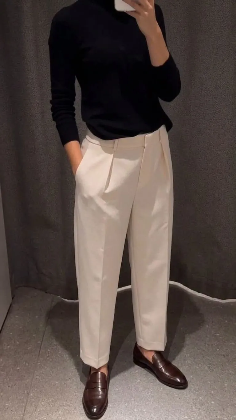 Leather slip-on loafers paired with neutral tailored trousers