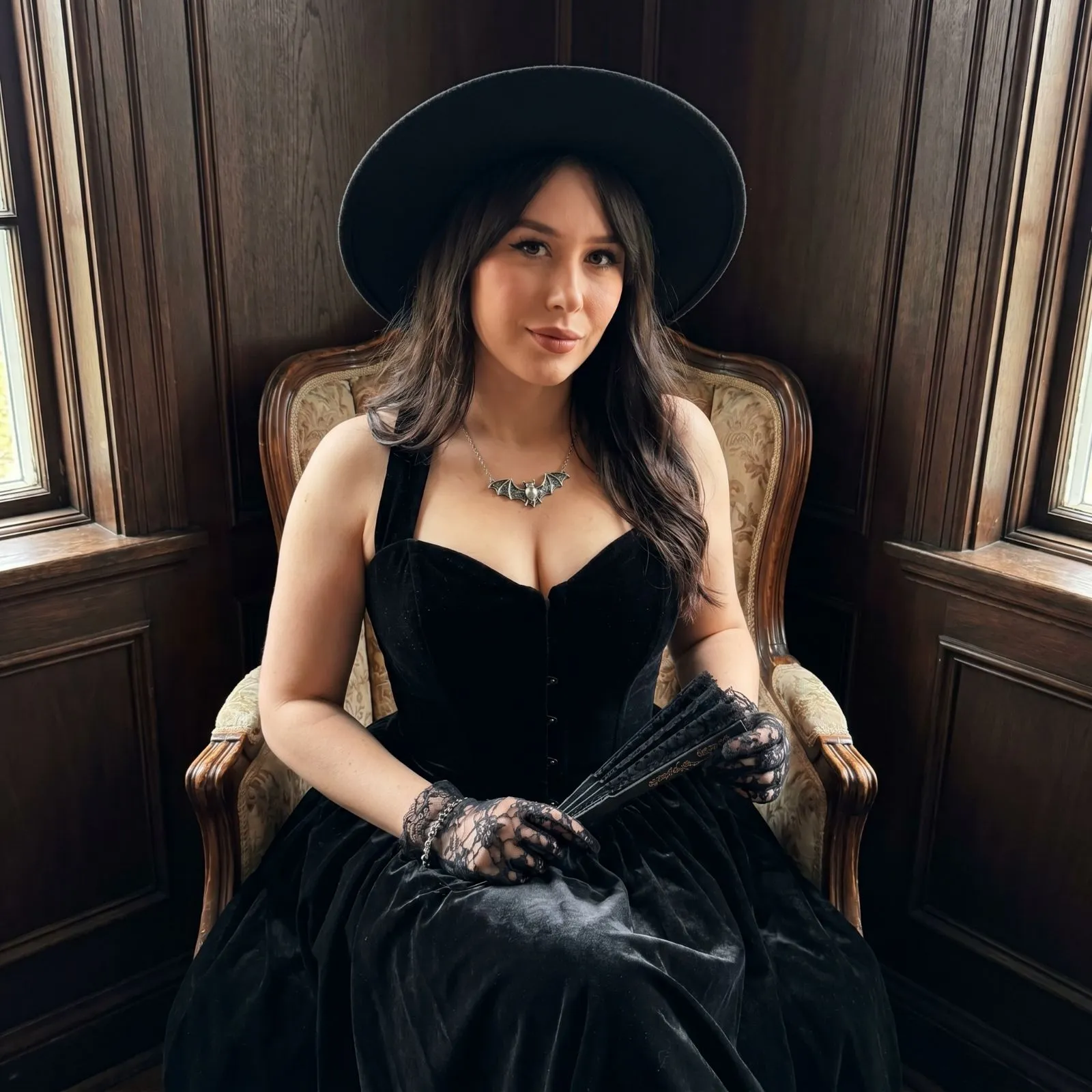 Plus size woman styling a gothic black velvet gown with accessories