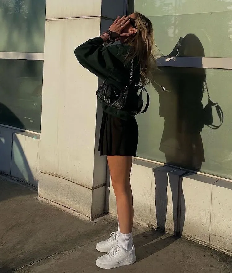 White leather sneakers and athletic socks for a baseball game date