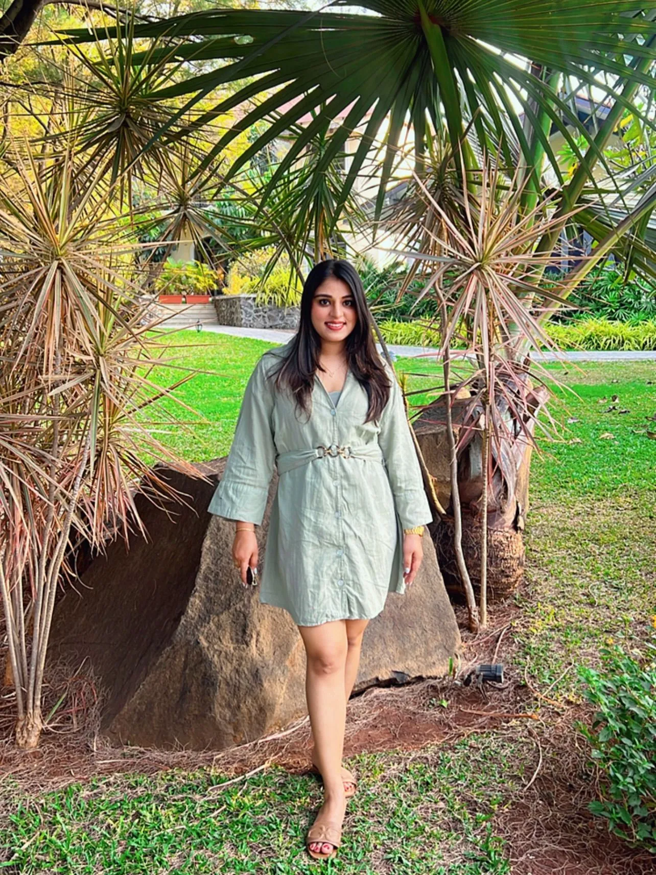 Woman touching the soft fabric of a linen blend dress