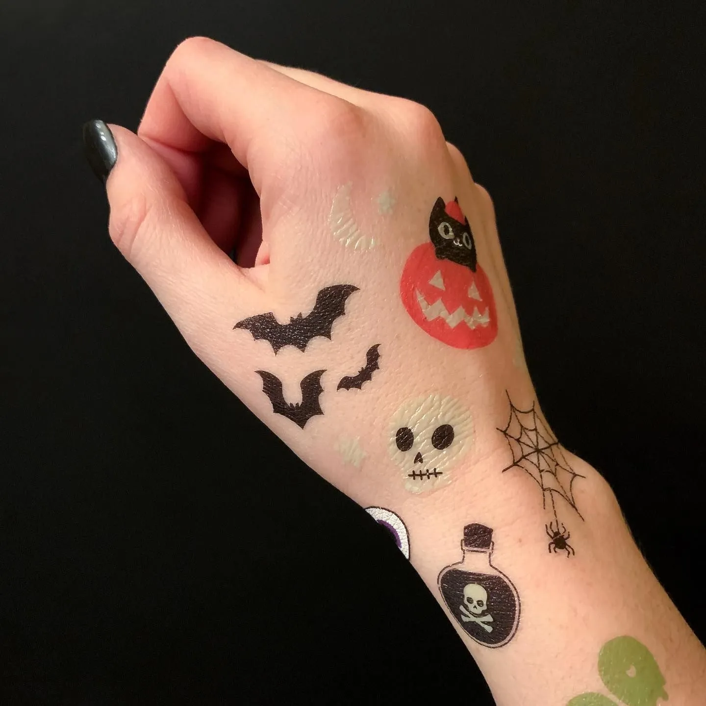 Aesthetic forearm resting on velvet cushion showing prime tattoo placement