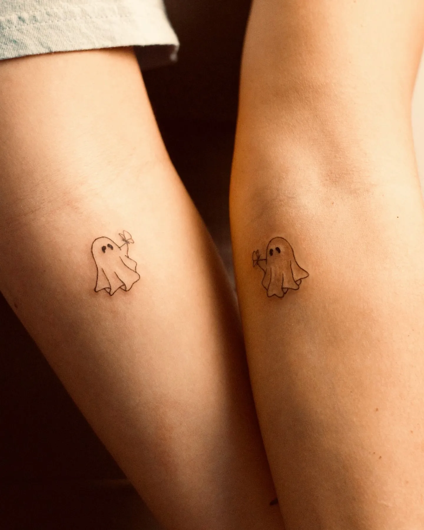 Close up of delicate black ink tattoo on radiant skin