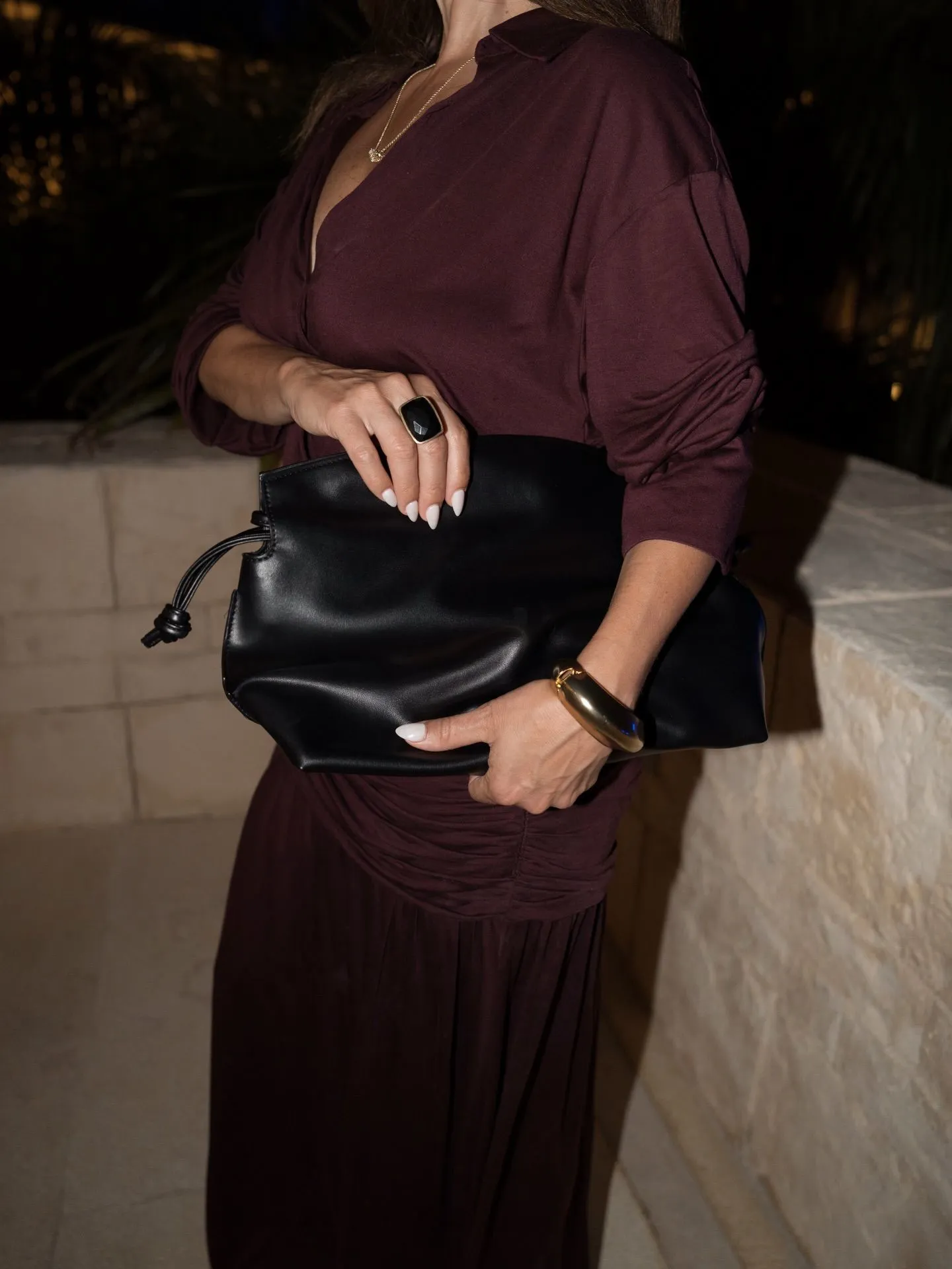 Close up of soft burgundy cashmere fabric on a plus size woman