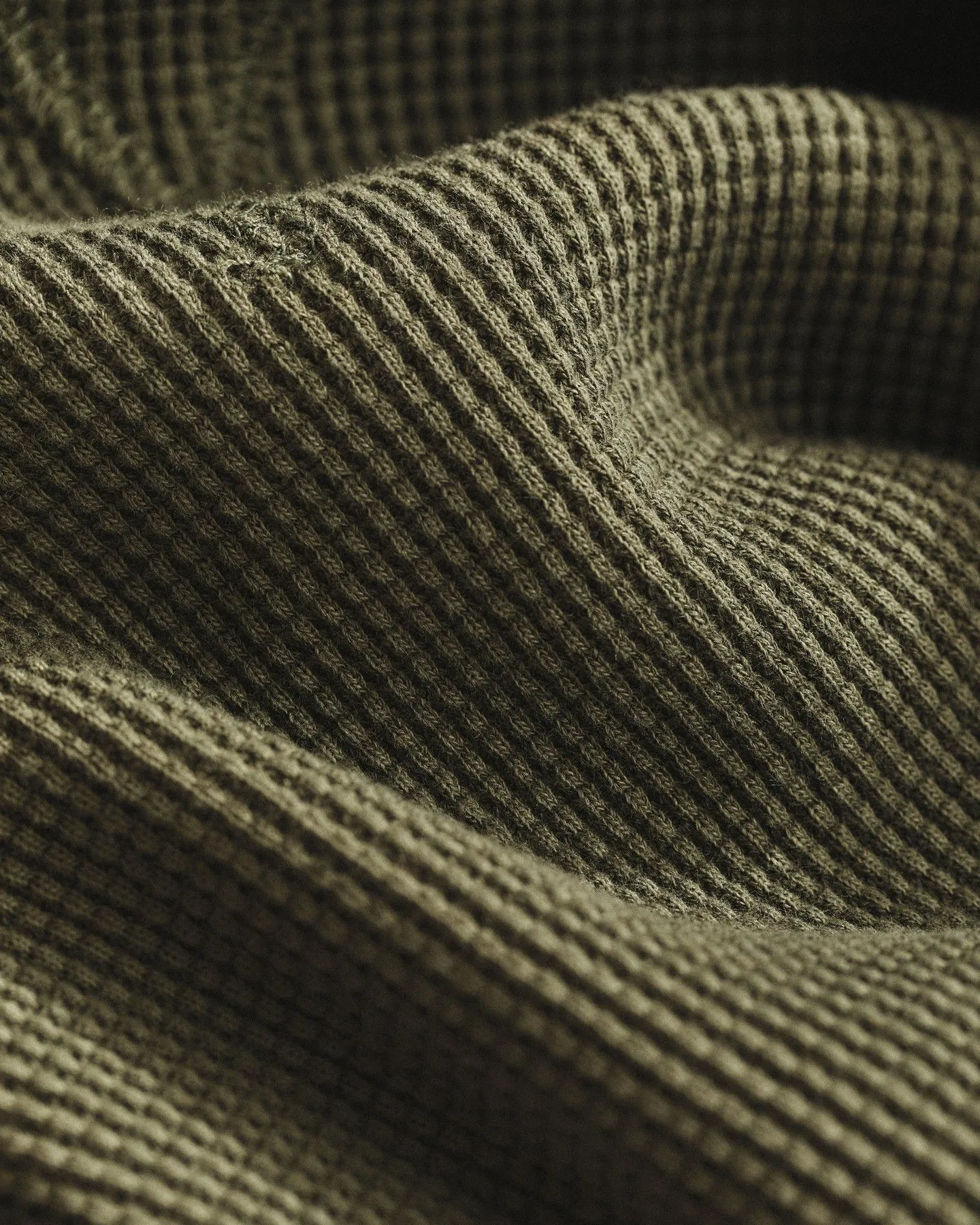 Heavy camel-colored ribbed knit fabric texture