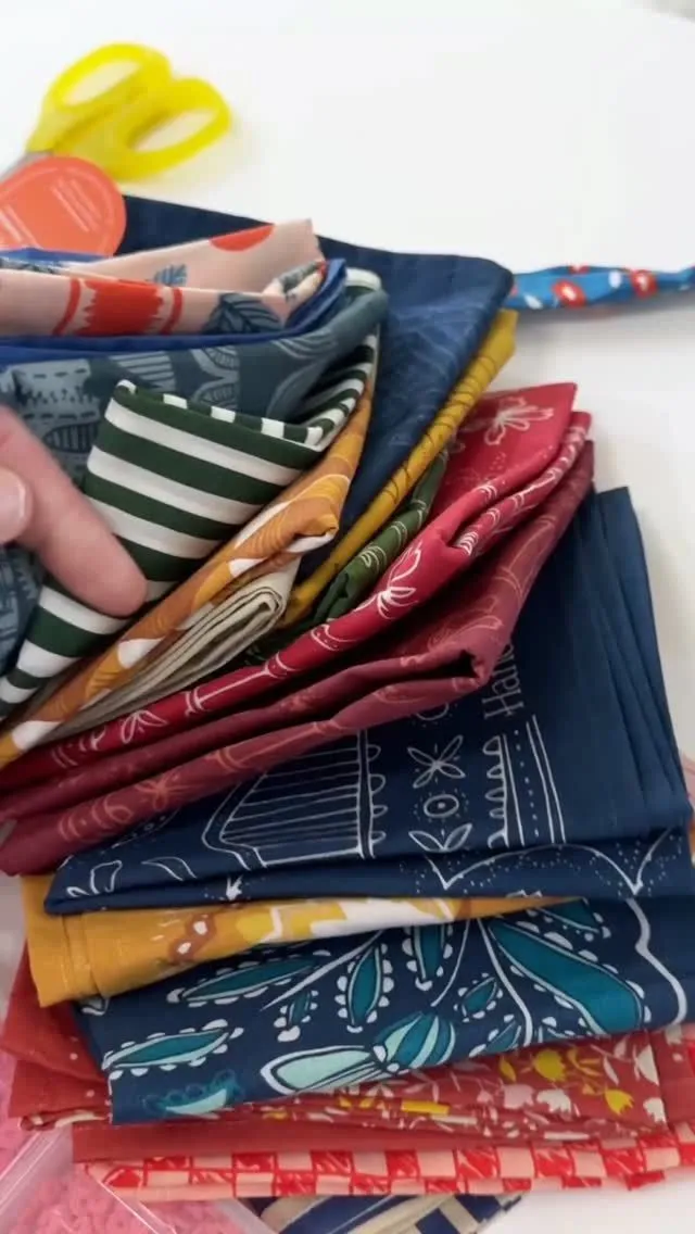 Selection of silk bandanas in autumn colors like olive and mustard