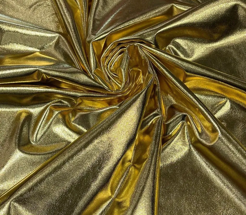 Close up of gold and silver metallic lamé fabric.