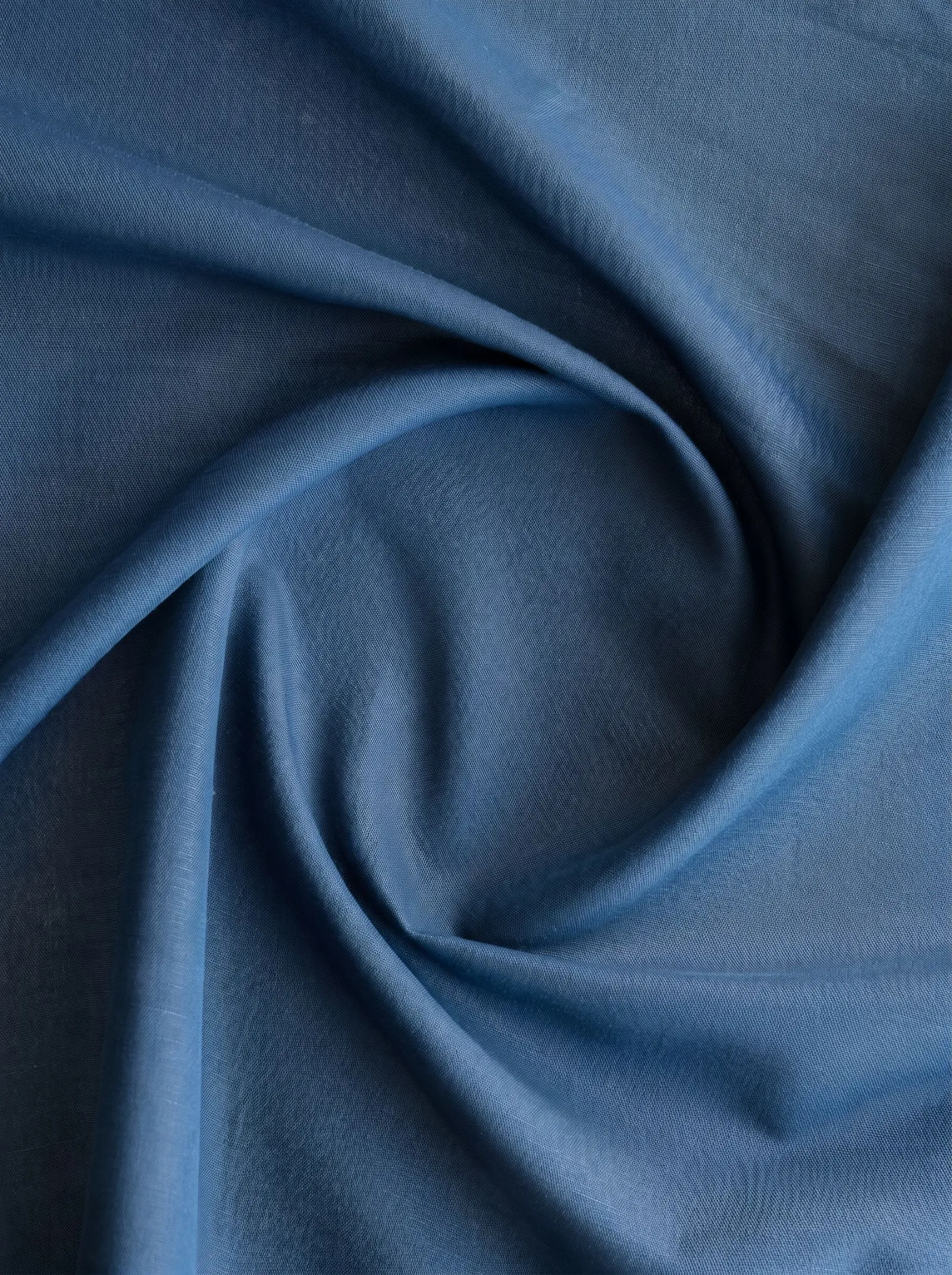 Macro texture shot of navy blue woven linen fabric