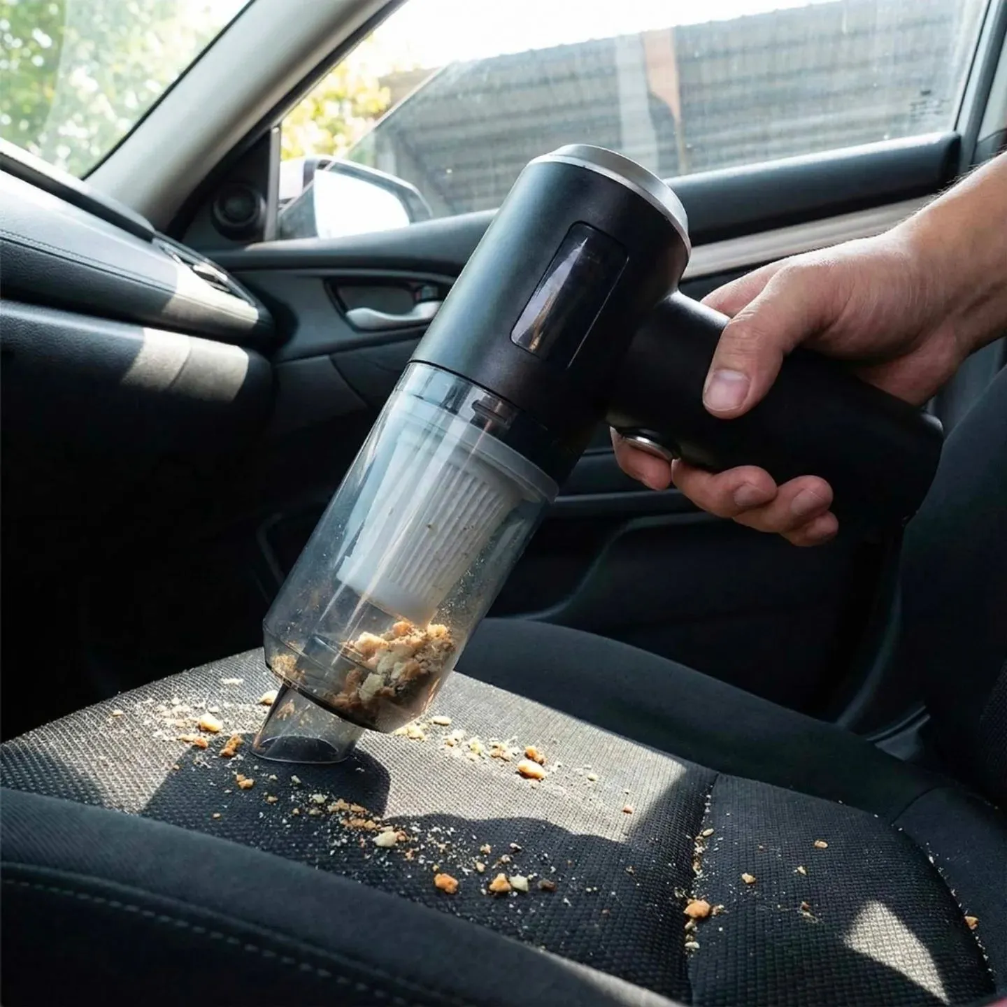 Close up of matte cream car vacuum being used in luxury car
