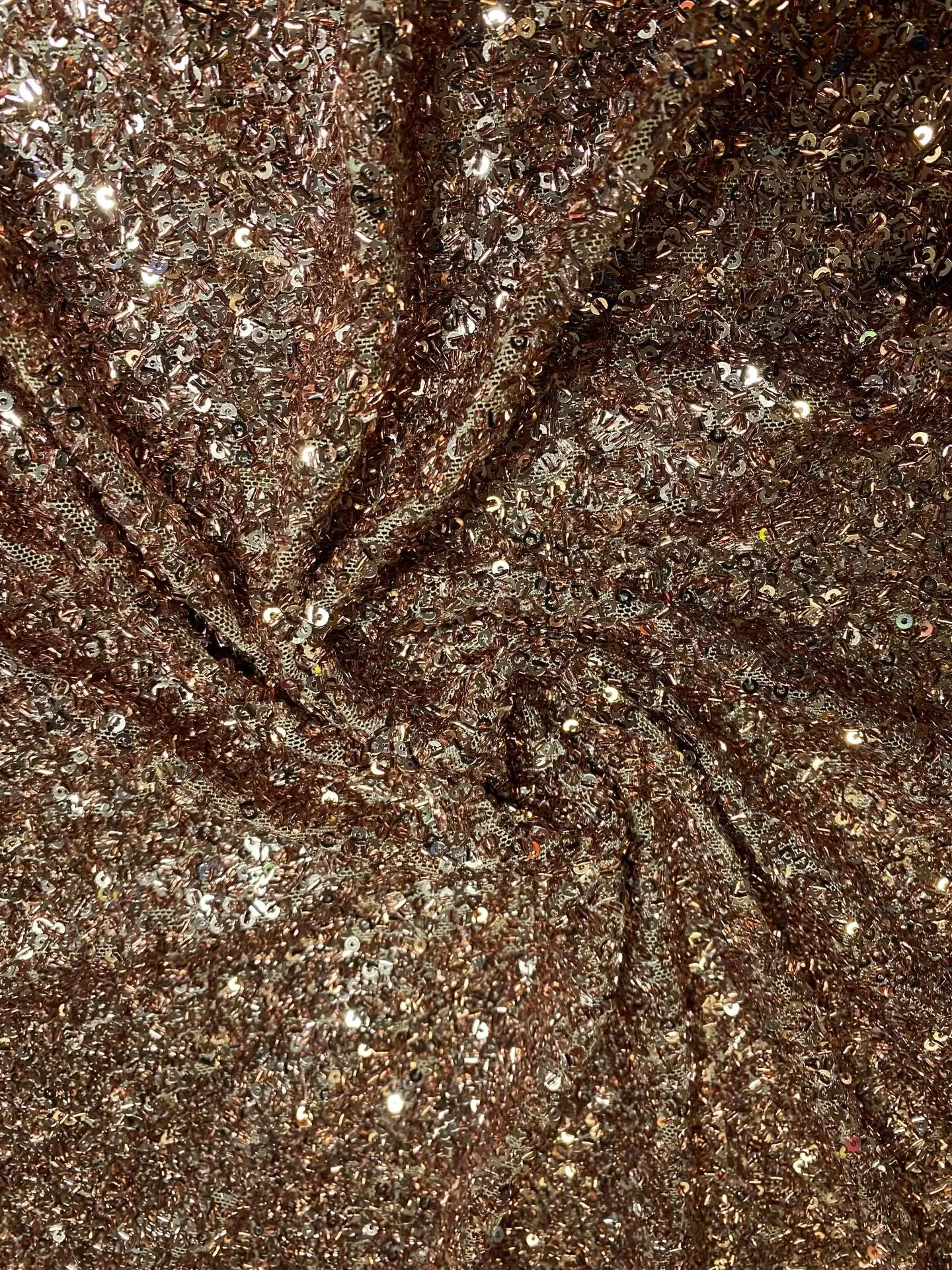 Close up of silver and gold sequin fabric