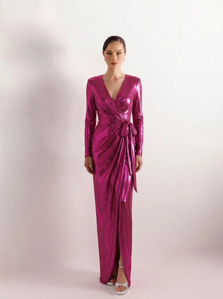 A woman wearing a fuchsia metallic wrap dress for a cruise dinner.